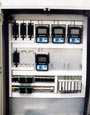 control enclosure containing a PLC, dual redundant power supplies, flow meters, and expansion space